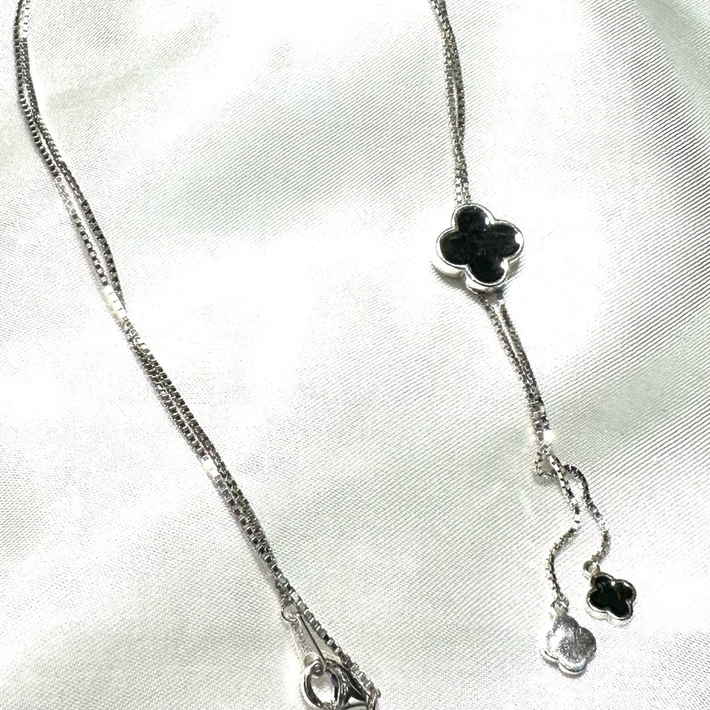 Silver necklace with black quatrefoil -Measures 16 in drop / 32 length